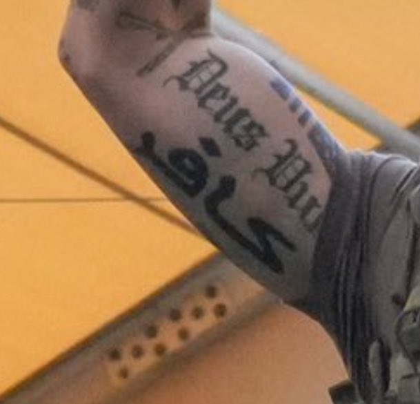 deus vult tattoo'ed on the Secretary of
Defense/War